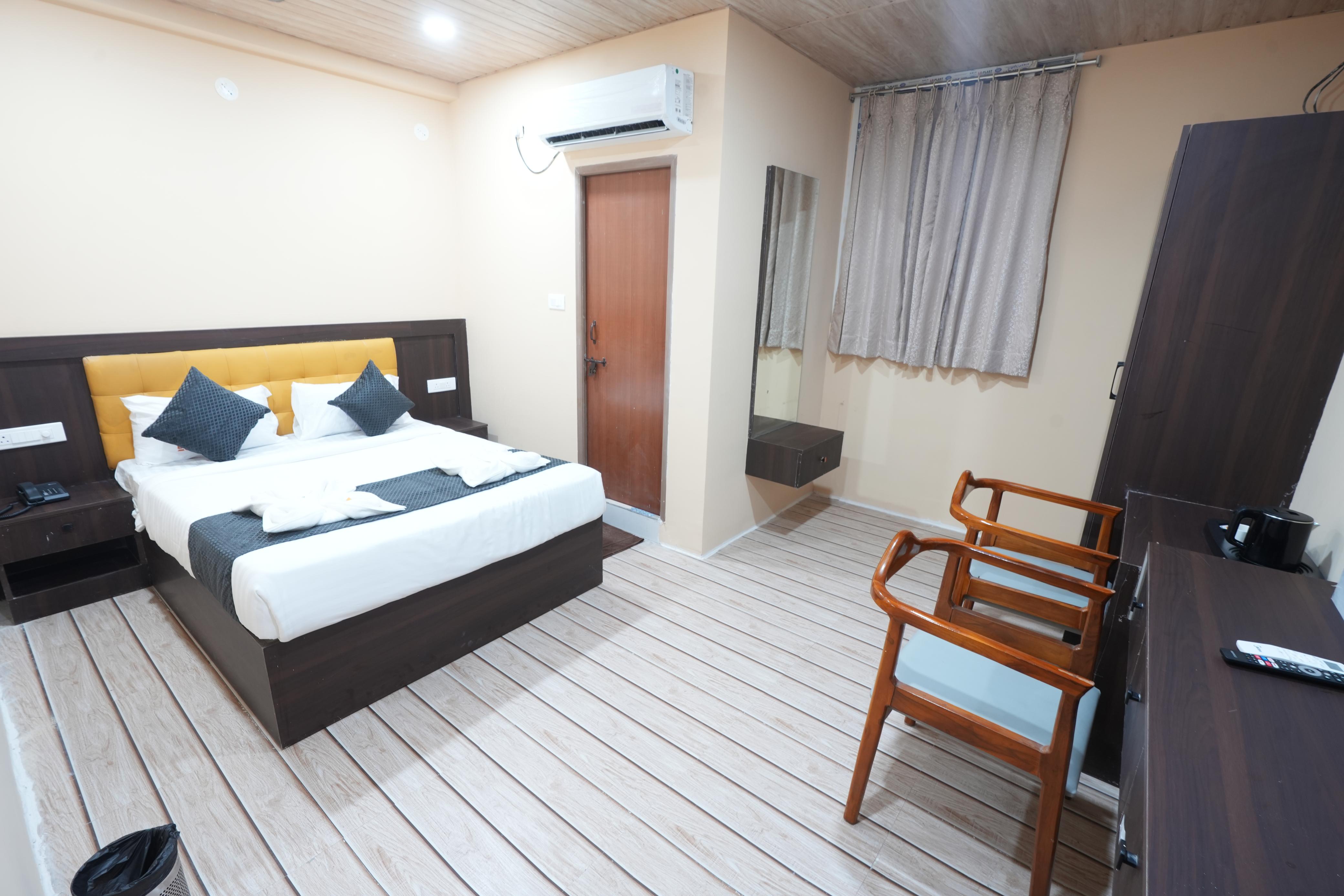 Guest bedroom at Hotel Dharani Grand Gachibowli