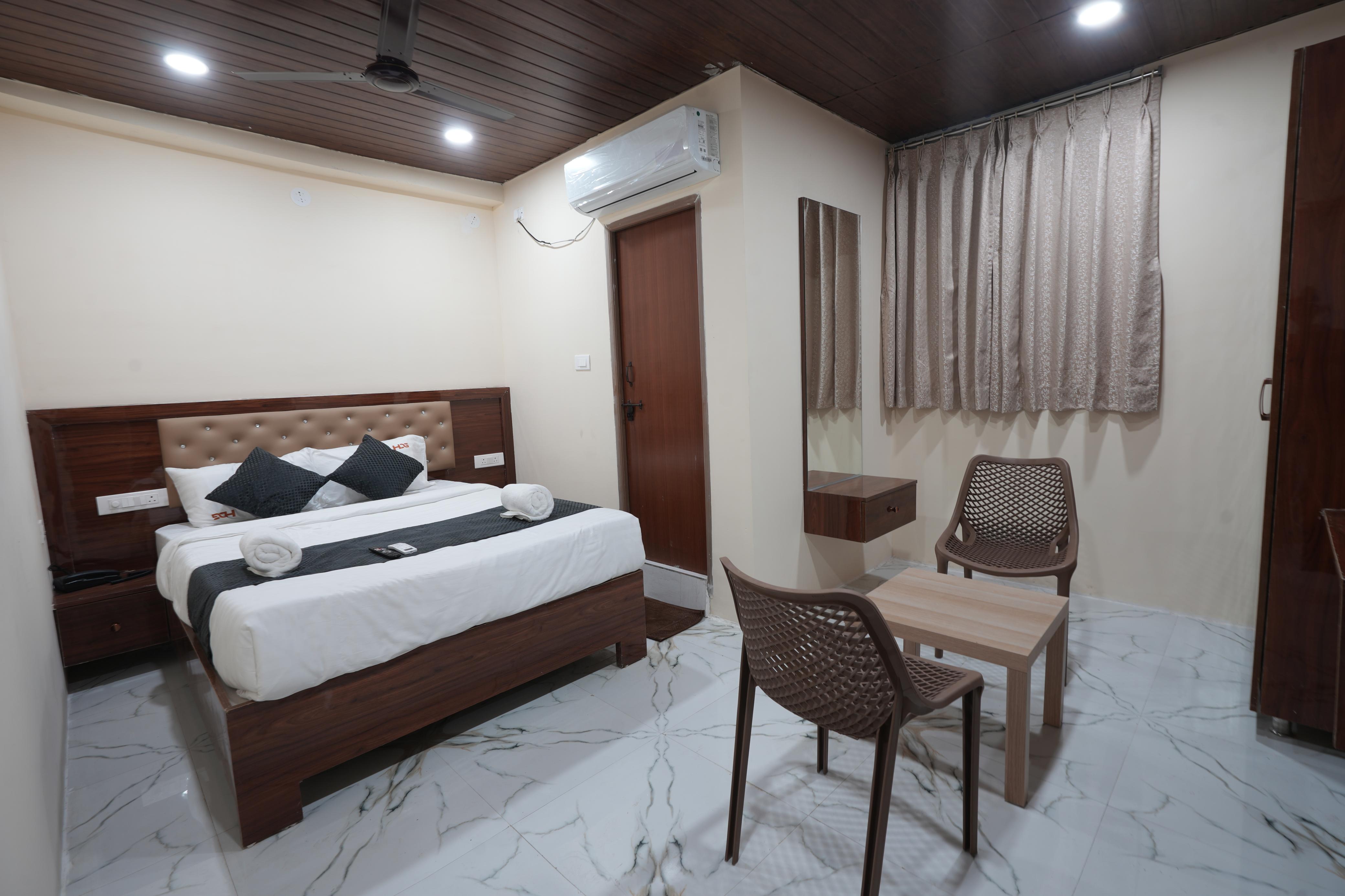 Comfortable guest room at Hotel Dharani Grand Gachibowli