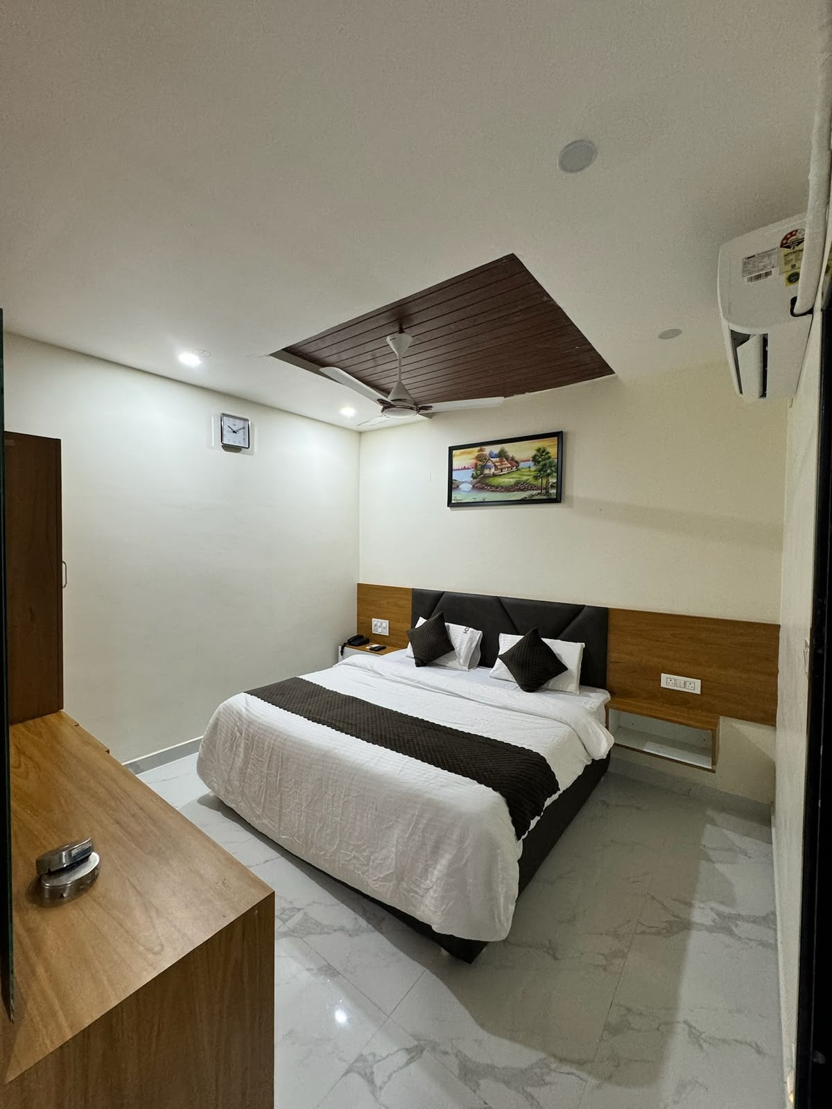 Guest bedroom at Hotel Dharani Grand Khammam