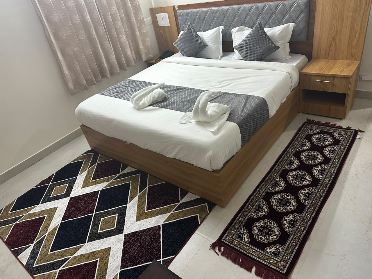 Guest bedroom at Hotel Dharani Grand KPHB