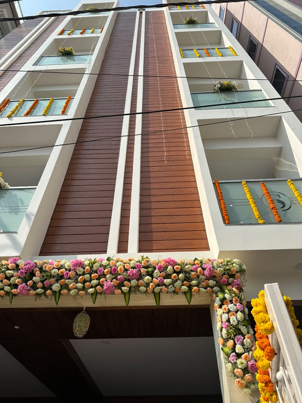 Hotel Dharani Grand KPHB entrance with floral decoration